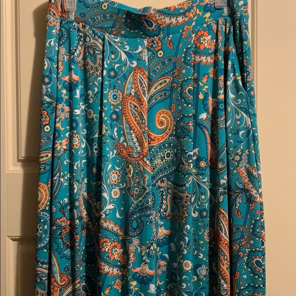 Teal and orange pleated slacks with pockets